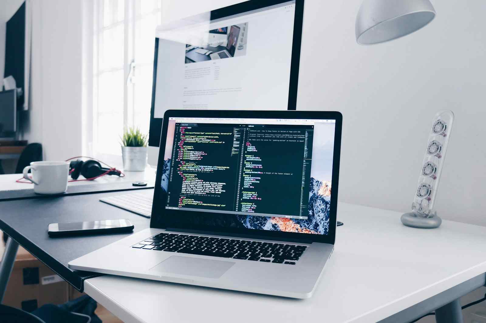 Laptop and remote work gear on a desk
