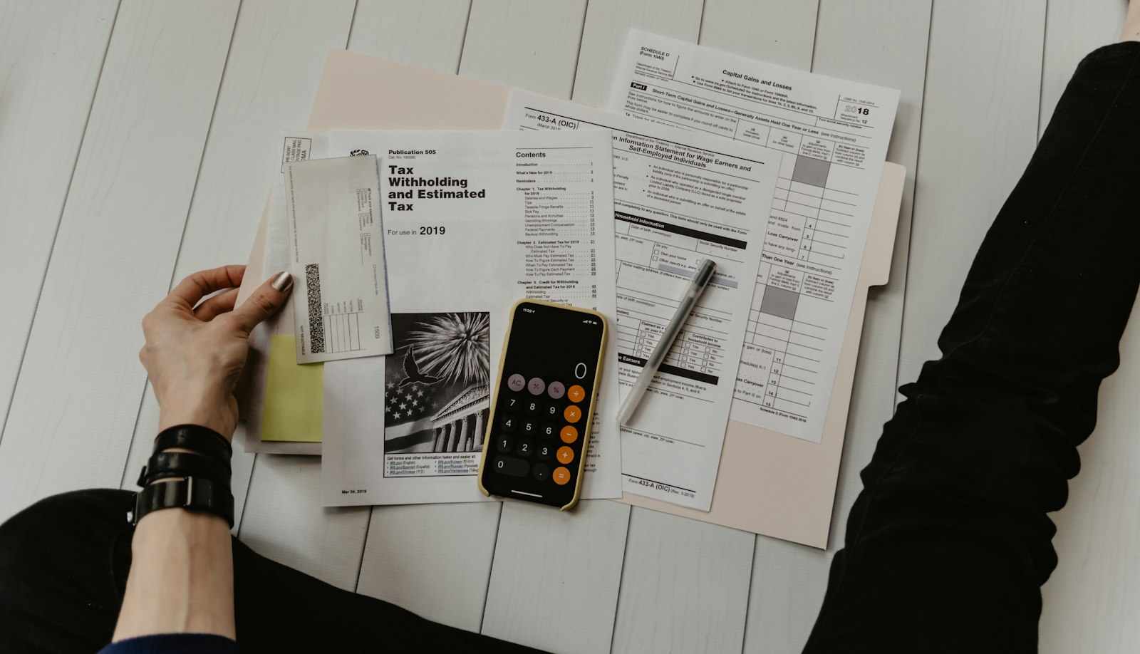 Laptop and documents representing tax and residency planning