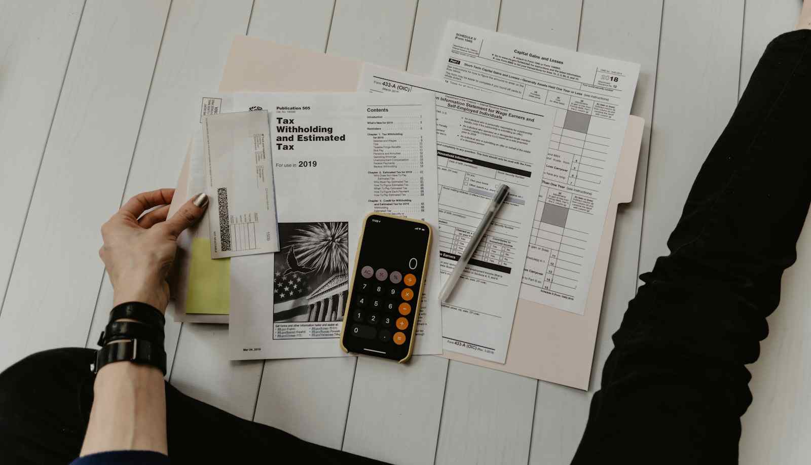 Laptop and documents representing tax and residency planning